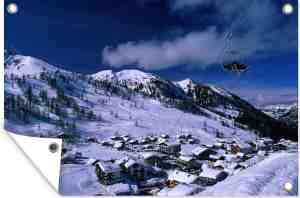 Foto: Muurdecoratie ski resort in liechtenstein op een winterdag 180 x 120 cm tuinposter